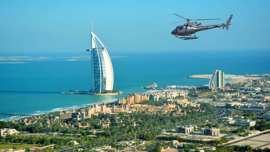 Dubai: Helicopter Ride, Old Town Walking Tour, Abra & Snacks - Taking in Dubai from a 12-minute helicopter flight
