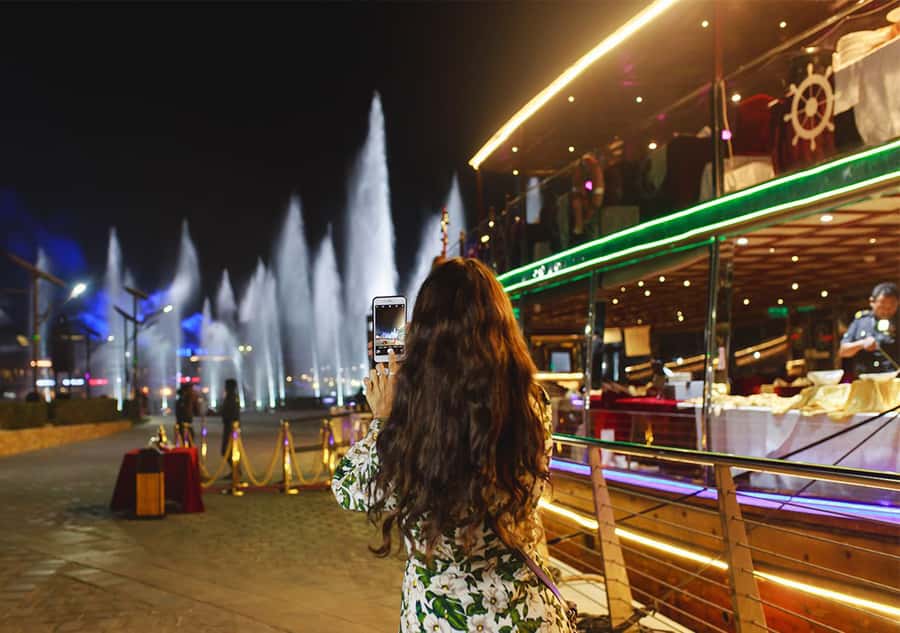 Dubai: Luxury Canal Dinner Cruise with Optional Transfers - A glass-enclosed dhow with Dubai as the backdrop