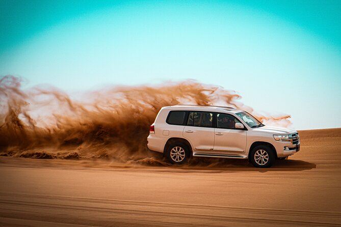 Dubai Morning Desert Safari with Quad Biking & More Activities - Sandboarding on the dunes