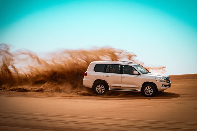 Dubai Morning Evening Desert Safari,Sand boarding and Camel ride - What dune bashing feels like in the red sand