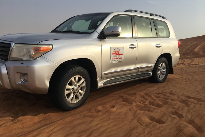 Dubai Morning & evening Desert Safari Tours - Sandboarding, camel riding, and photo stops