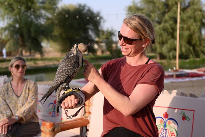 Dubai: Morning Heritage Safari by Vintage G Class & Al Marmoom Oasis - Arabic coffee, traditional clothing, and falcon photos