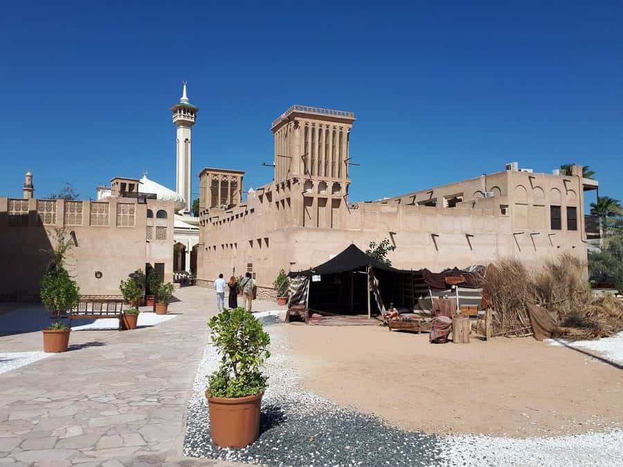 Dubai: Old City Walking Tour with Abra Ride - The Old Textile Market adds color and commerce