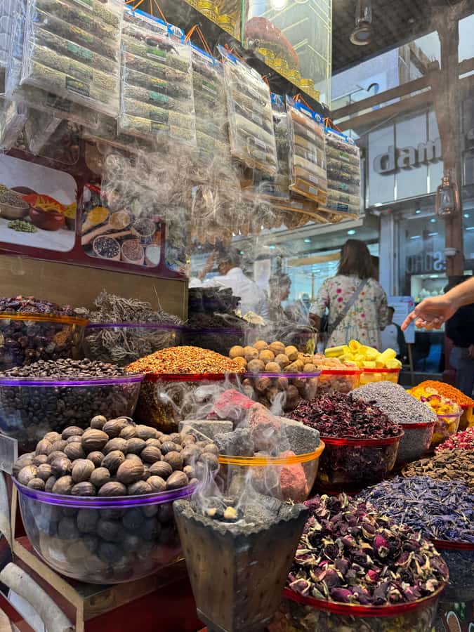Dubai: Old Town Walking Tour with Abra Cruise & Street Food - The Textile Souk and the first market lessons