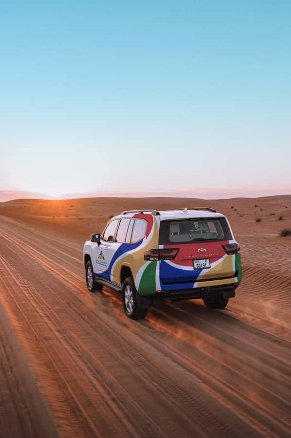 Dubai: Premium Desert Safari, Camel Ride, BBQ & Sandboarding - Sunset drinks and open desert views
