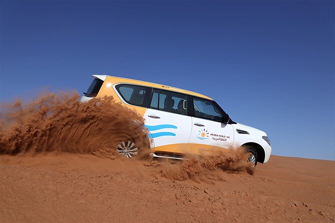 Dubai Premium Desert Safari with Live shows & Gourmet Dinner - The camp evening: food, shows, and a large crowd