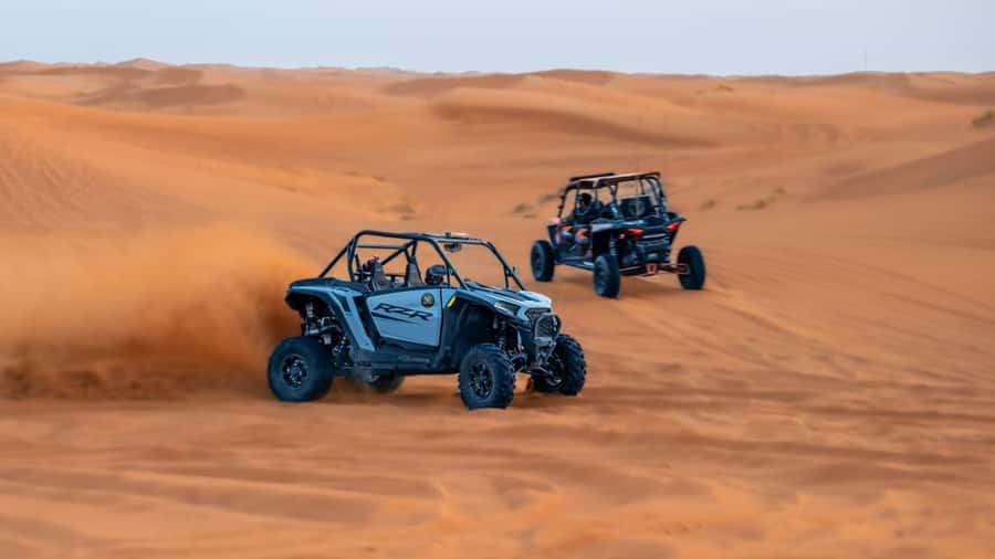 Dubai: Private Dune Buggy, Camel Ride, and Sand Boarding! - Red dunes, rock formations, and sunset color