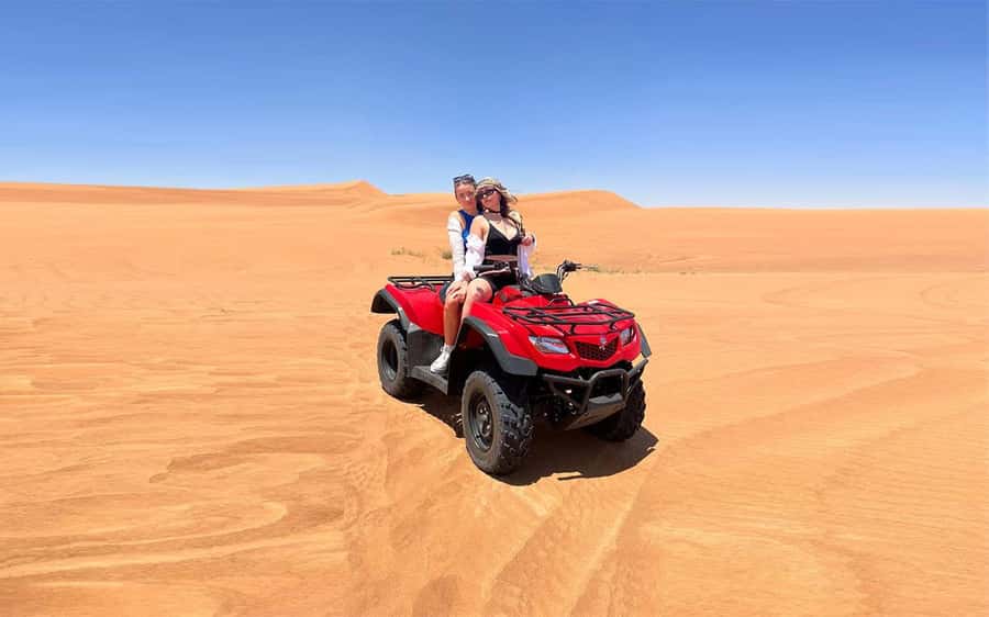 Dubai: Quad Bike, Dune Buggy, and Sandboarding Experience - Leaving Dubai for the red dunes