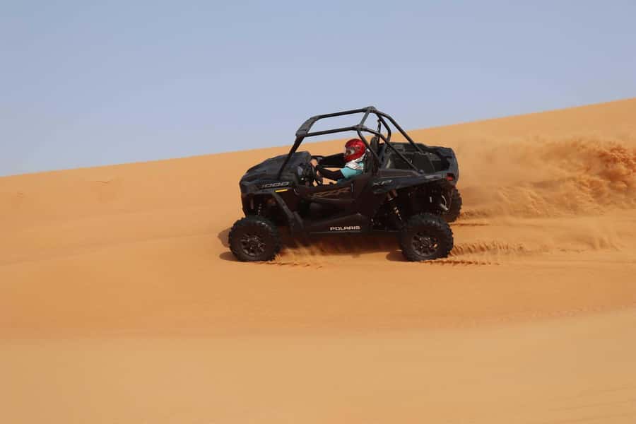 Dubai: Quad Bike, Dune Buggy, and Sandboarding Experience - A short camel ride with a different pace