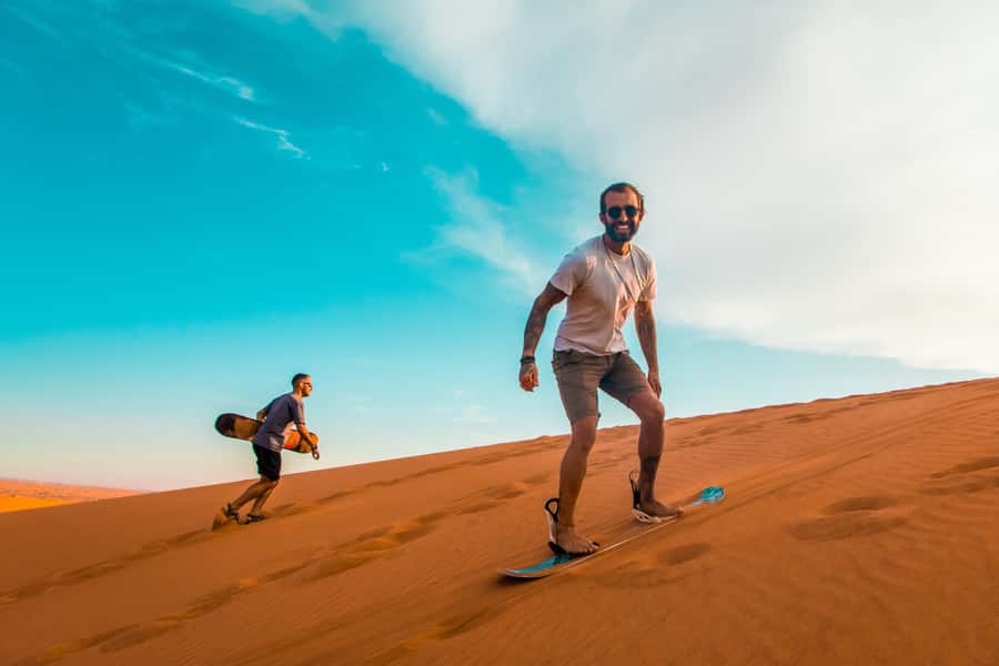 Dubai: Quad Bike Safari, Camels & Al Khayma Camp BBQ Dinner - Sandboarding and photos among the dunes