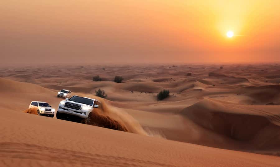Dubai: Red Dune Desert Safari, Quad Bike, Camels, and BBQ - Dune bashing: thrilling, brief, and not for everyone