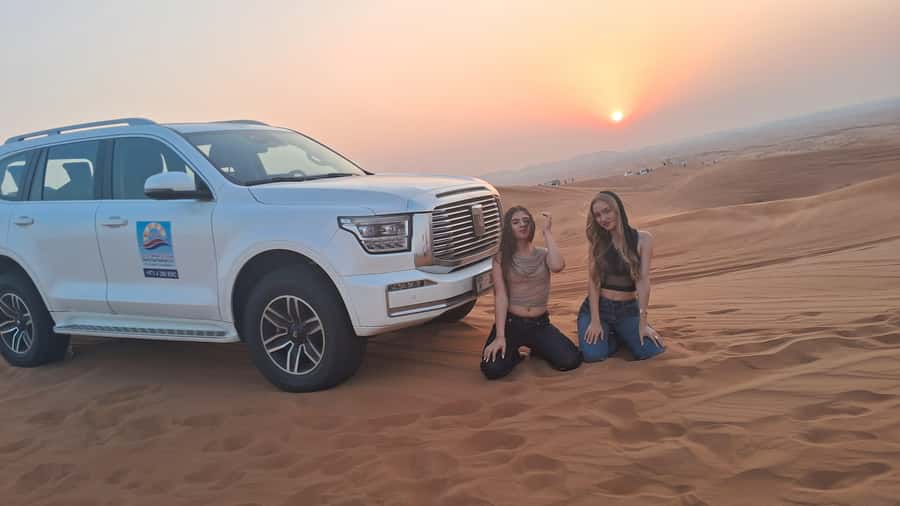 Dubai: Red Dunes Desert Safari with Premium Camp BBQ & Shows - Camel Ride, Falcon Photo, and Sandboarding