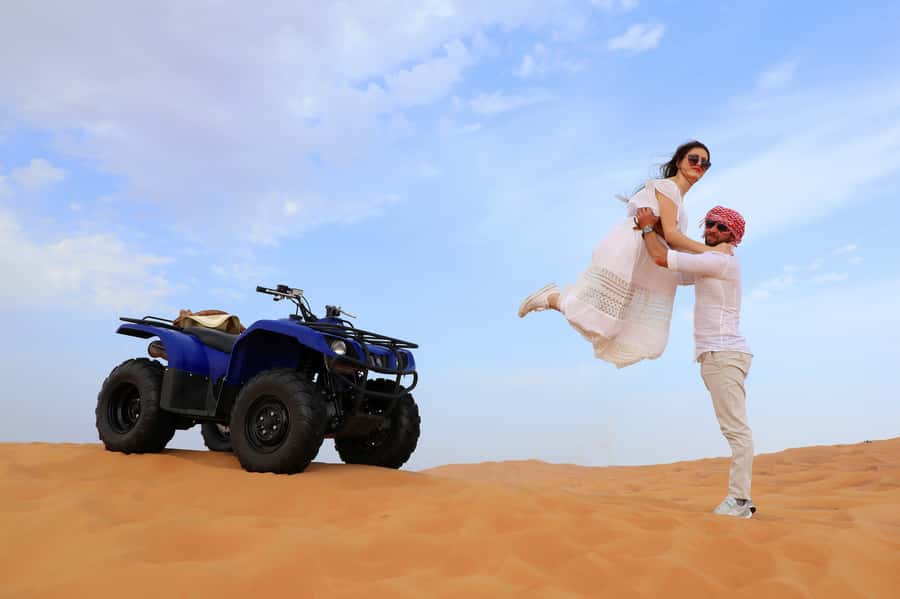 Dubai: Red Dunes Quad Bike with Sandboarding, Camels and BBQ - One hour on a quad bike across Lahbab