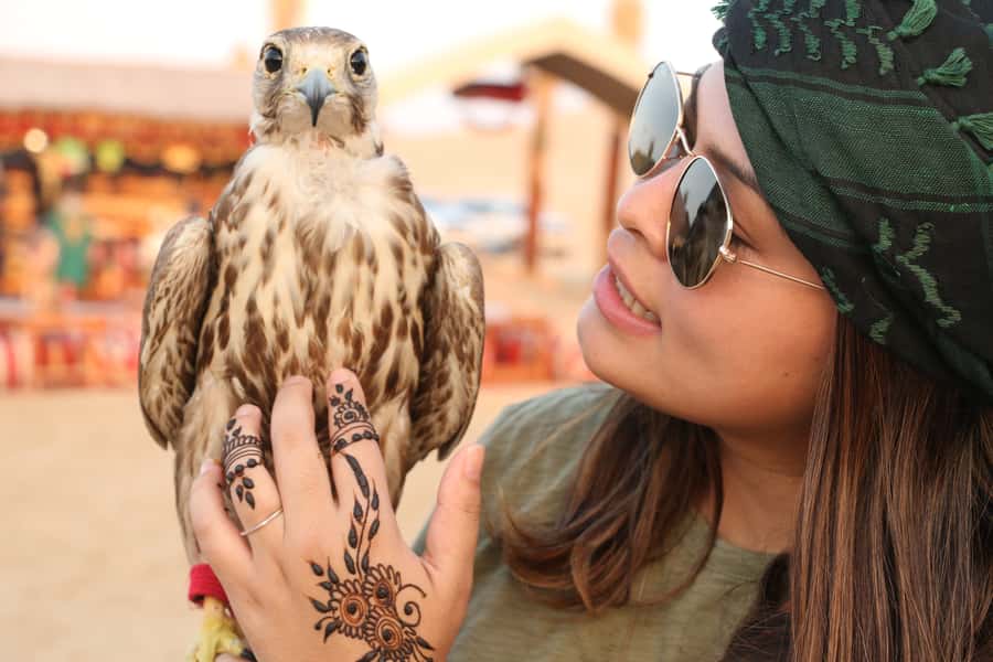 Dubai: Red Dunes Quad Bike with Sandboarding, Camels and BBQ - Fire, horses, camels, and Yola dancing