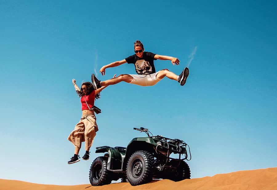 Dubai: Red Dunes Quad Bike with Sandboarding, Camels and BBQ - A cool welcome before the heat of Lahbab