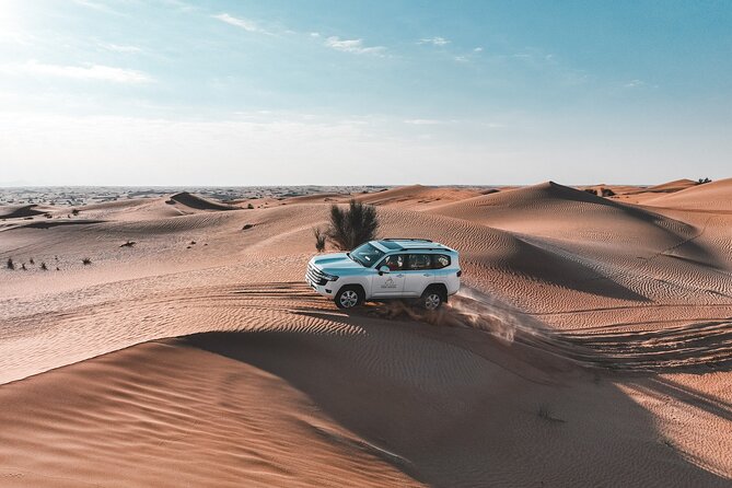 Dubai Red Dunes Safari: Dune Bashing, Camel Ride & Breakfast - Dune bashing across the red sand