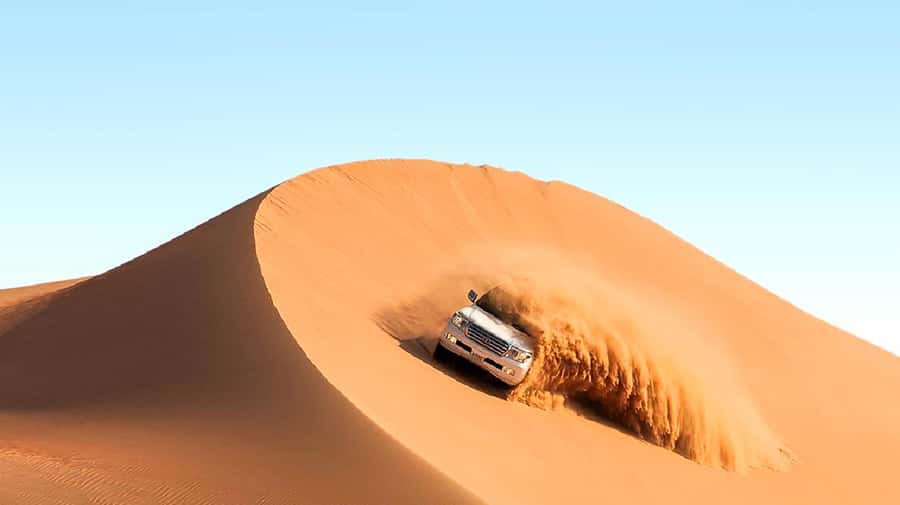 Dubai: Safari, Quad Bike, Camel Ride, and Buffet Dinner - Leaving Dubai for the red dunes