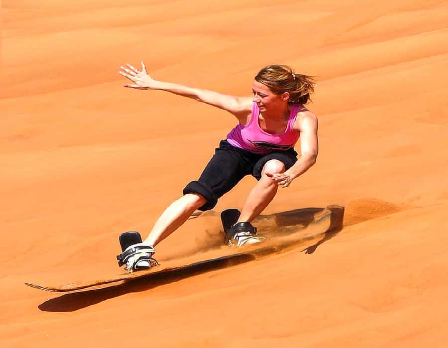 Dubai: Safari, Quad Bike, Camel Ride, and Buffet Dinner - Sandboarding and sunset photos