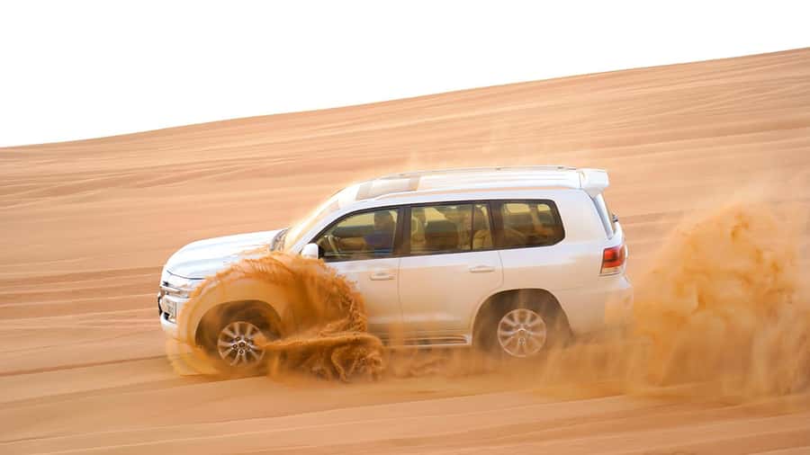 Dubai: Sandboarding, Camel Ride and Red Dune Bashing - Leaving Dubai for the Red Dunes