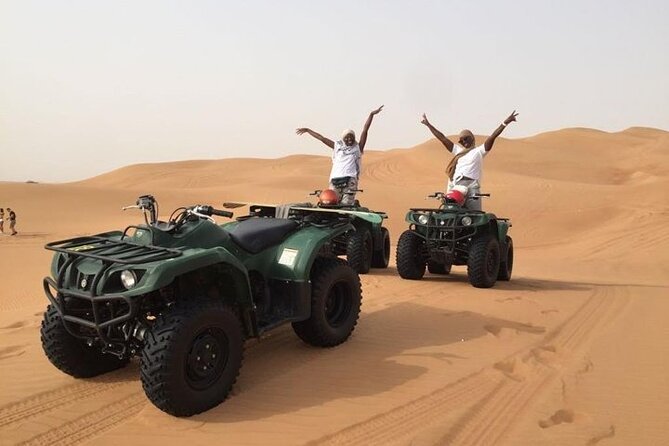 Dubai Self-drive Quad Bike, Sand Boarding, Camels & Refreshments - Arabian coffee, sweets, and the Bedouin-style camp