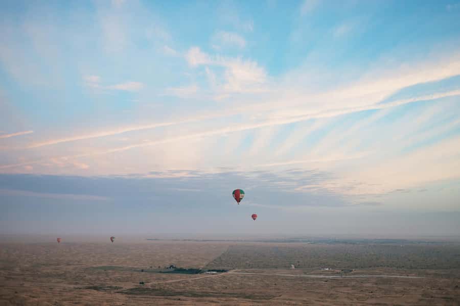 Dubai: Sunrise Hot Air Balloon Tour Over the Desert - The landing and ride back to Dubai