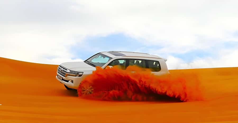 Dubai: Tour with BBQ Dinner, Camel Ride, & Traditional Show - From Dubai hotels to the Al Aweer desert