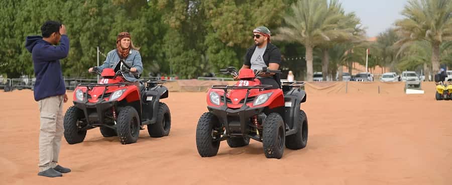 Dubai: Tour with BBQ Dinner, Camel Ride, & Traditional Show - The desert camp at night