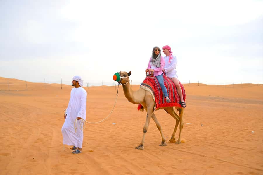 Dubai: Tour with BBQ Dinner, Camel Ride, & Traditional Show - Sunset, sand, and the question of dune bashing
