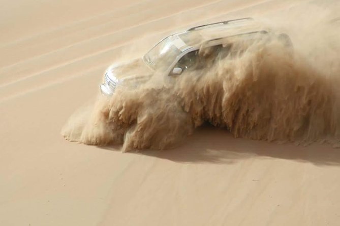 Dubai: Unique SUNSET 4WD Red Dunes Safari - Sandboarding and a sunset on the highest dunes