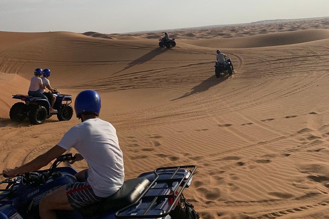 Dubai: Unique SUNSET Quad Bike Red Dunes Safari - Henna and evening entertainment