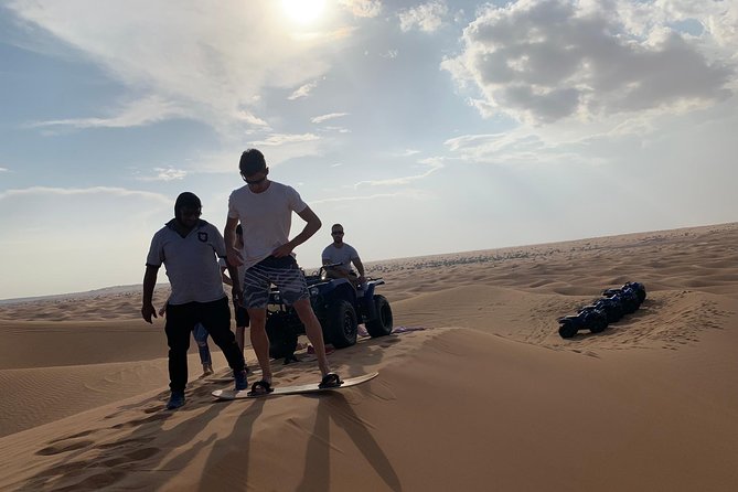 Dubai: Unique SUNSET Quad Bike Red Dunes Safari - Pickup, timing, and what to wear