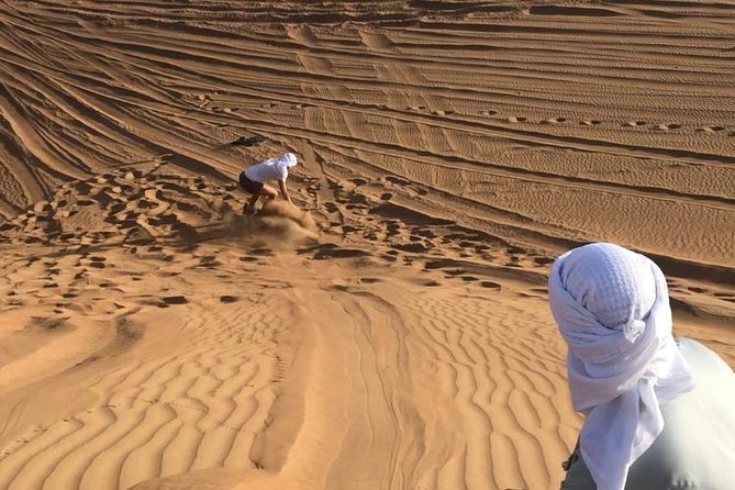 Dubai: Unique SUNSET Quad Bike Red Dunes Safari - The camel ride slows the afternoon down