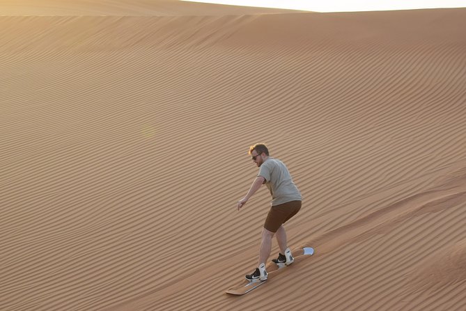 Dune Bashing and Buggy Self Drive from Dubai - Sand boarding on the high red dunes