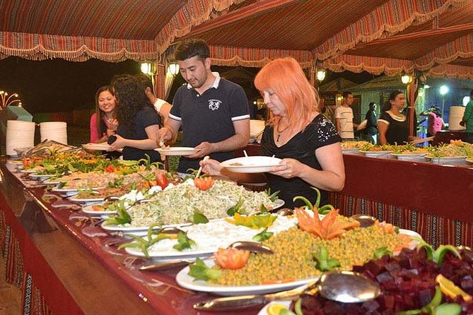 Evening Desert Adventure: Quad Biking, Sandboarding & Camel Ride - Tanoura, Belly Dancing, and Fire Entertainment