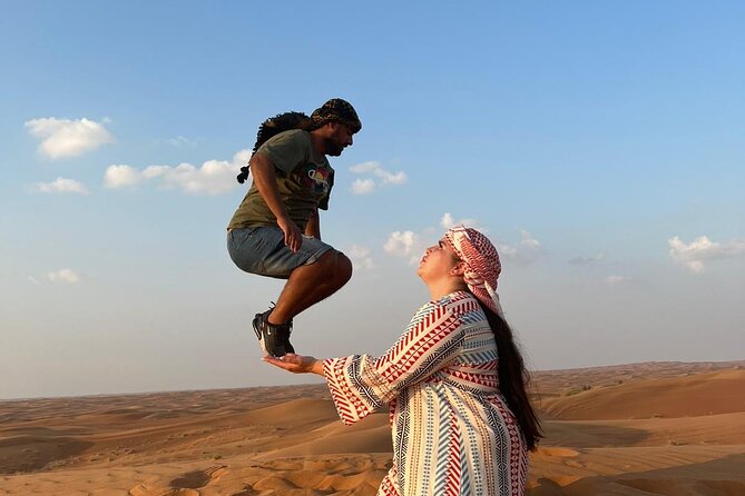 Evening Desert Safari Camel Ride Dinner Live Shows in Abu Dhabi - A Bedouin-style camp with tea, dates, and henna