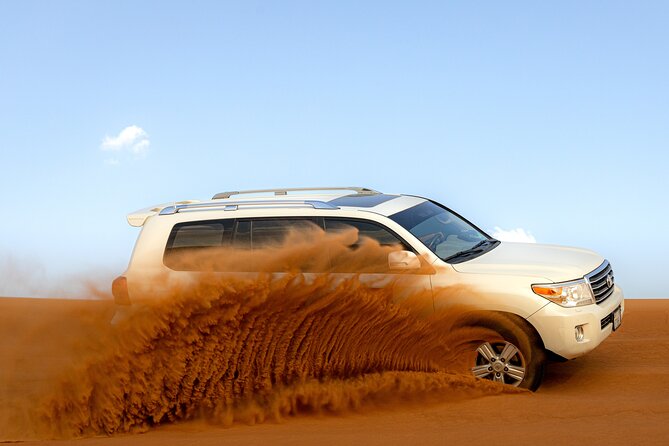 Evening Desert Safari in Dubai, Sandboard & BBQ Dinner - Two hours of dune bashing, sandboarding, and desert views