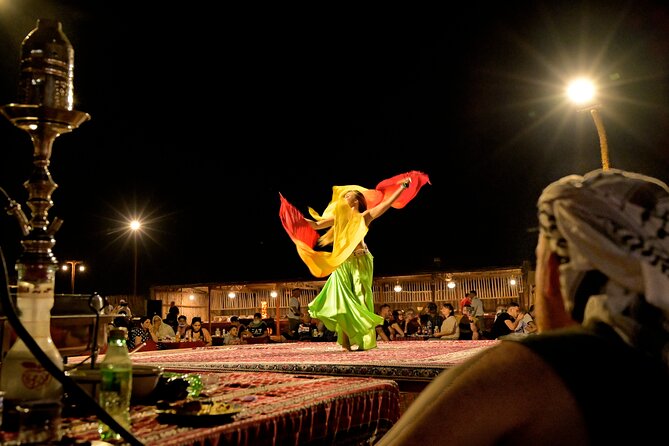 Evening Desert Safari in Dubai, Sandboard & BBQ Dinner - Fire, Tanoura, and belly dance after dark