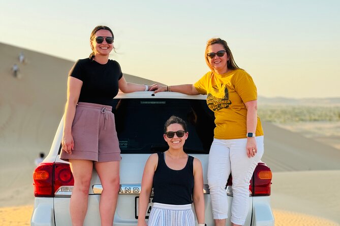 Evening Desert Safari Quad Bike and Live BBQ - Camel riding, sandboarding, and the sunset stop