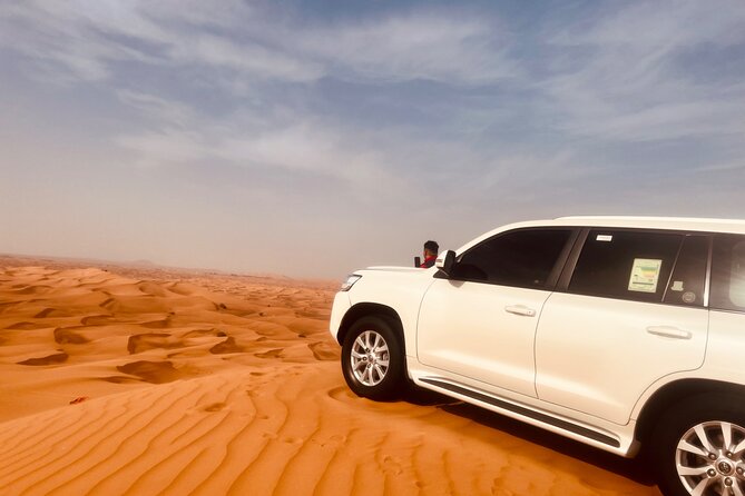 Evening desert safari with camel ride and BBQ dinner - Sandboarding and the optional quad bike
