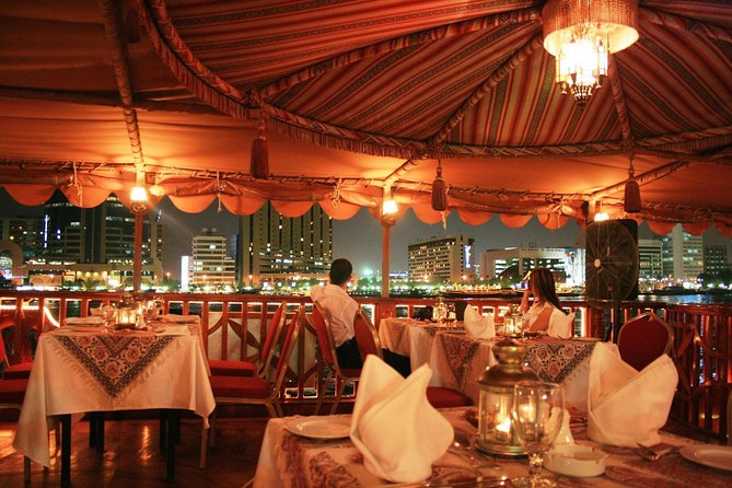 Evening Dhow Dinner Cruise in Dubai - The wooden dhow and the view from the upper deck