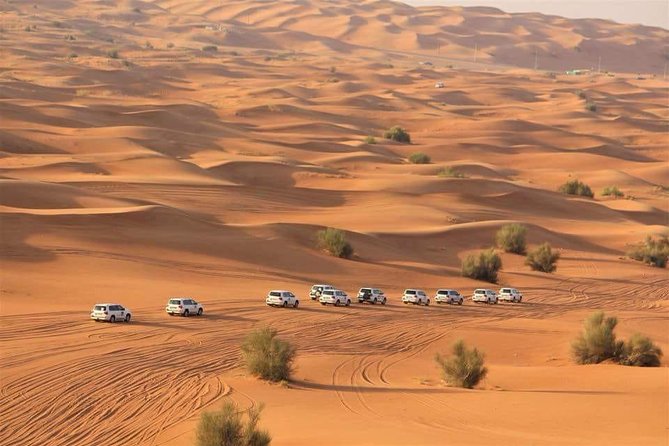 Evening Red Dunes Desert Safari: BBQ Dinner & Adventure Awaits! - Red dunes, sunset, and a packed evening