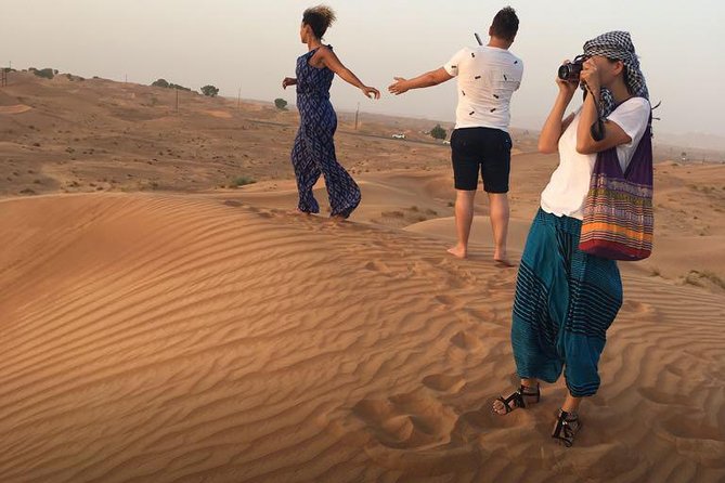 Evening Red Dunes Desert Safari: BBQ Dinner & Adventure Awaits! - Belly dancing, tanoura, and fire shows