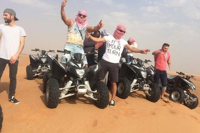 Evening Red Dunes Safari with Quad Biking, BBQ Dinner & LiveShows - Sandboarding adds an easy extra thrill