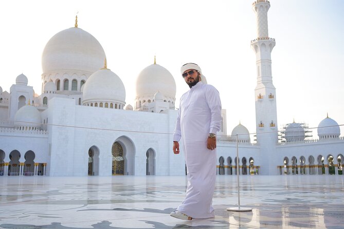 From Dubai: Abu Dhabi Sheikh Zayed Grand Mosque Guided Tour - First sight of the mosque: scale, symmetry, and white marble