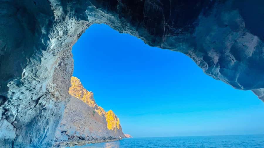 From Dubai/Sharjah/RAK: Dibba Musandam Trip & Dhow Cruise - A beach stop and the natural limestone cave