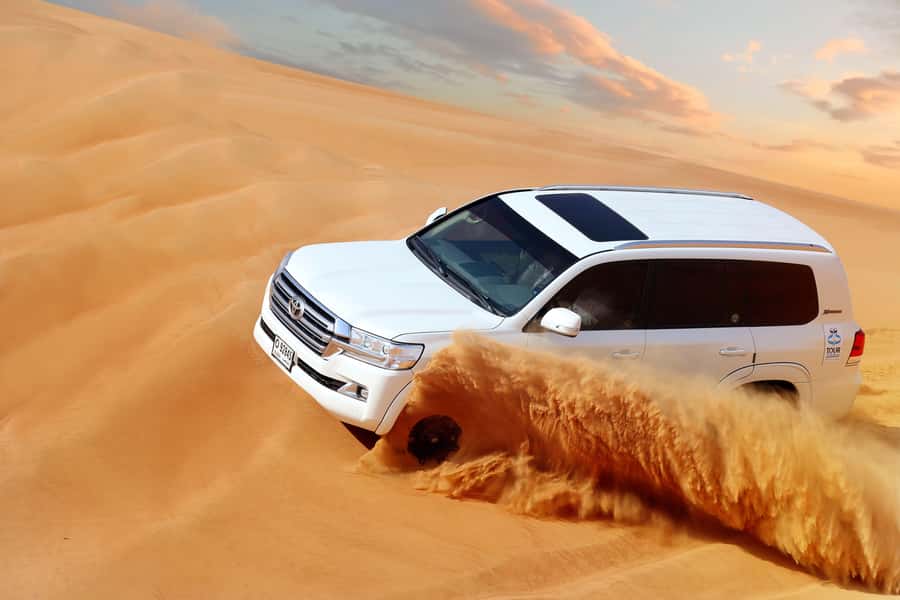 Luxury Dubai Desert Safari, BBQ, Camel Ride, Quad Bike, Show - Fire, dance, and Arabic music after dark