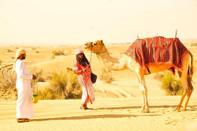 Morning Red Dunes Desert by Quad Bike, Dune Bashing, Camel Ride & Sandboarding - A short camel ride for a traditional touch
