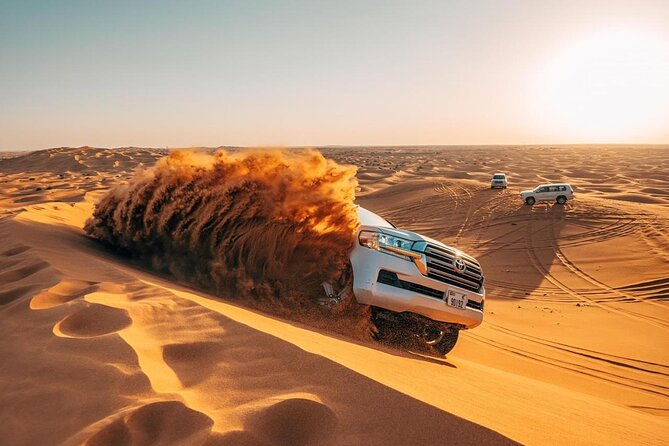 Morning Red Dunes Safari: Camel Ride & Sandboarding Adventure - Pickup from Dubai and the early start