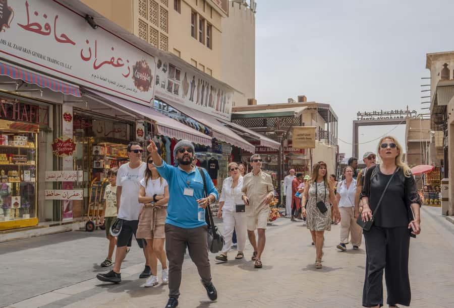 Old Dubai Historic Guided Tour: Creek, Street Food & Souks - Crossing Dubai Creek in a traditional abra