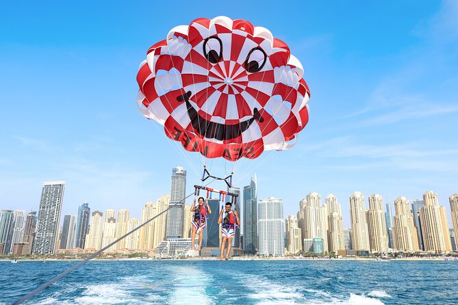 Parasailing in Dubai with Palm Jumeirah and JBR Beach views - Heat, weather, and possible cancellations